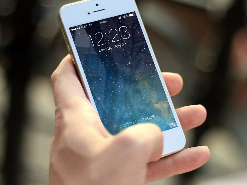 Smartphone in hand as a symbol for Product Innovation - TOM SPIKE