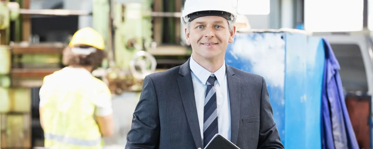 Technical manager in factory hall - symbol of successful technology innovation - TOM SPIKE